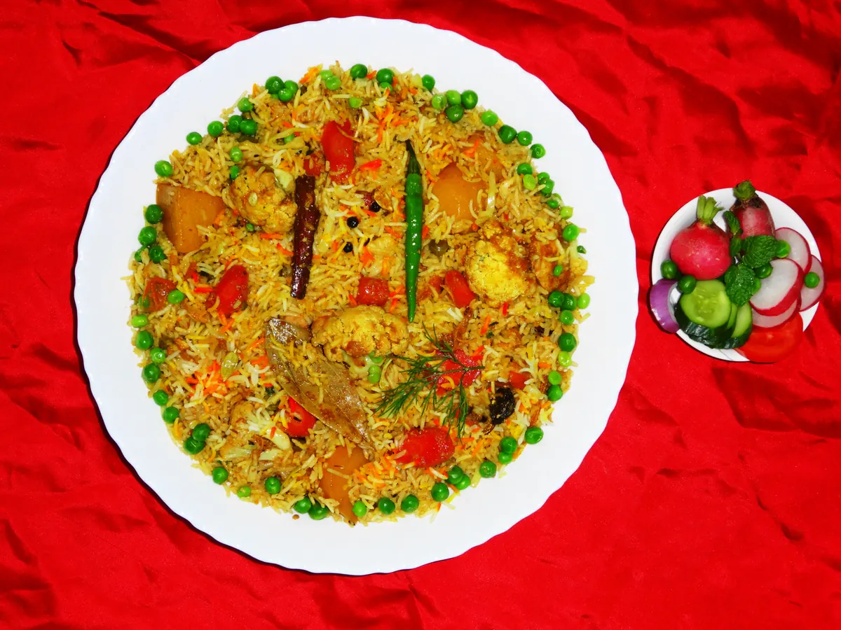 Vegetable biryani served with raita
